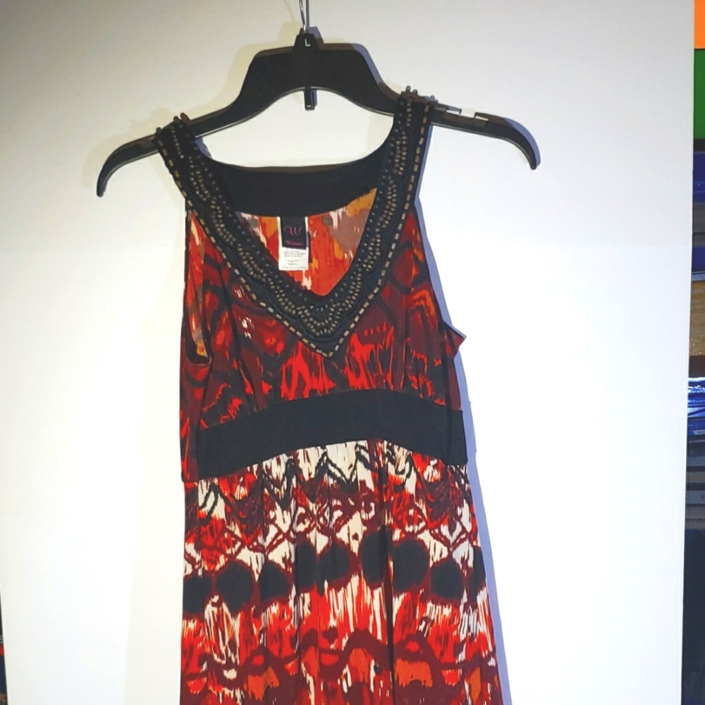 Wrapper sleeveless dress, women's S; red, black, white patterns.